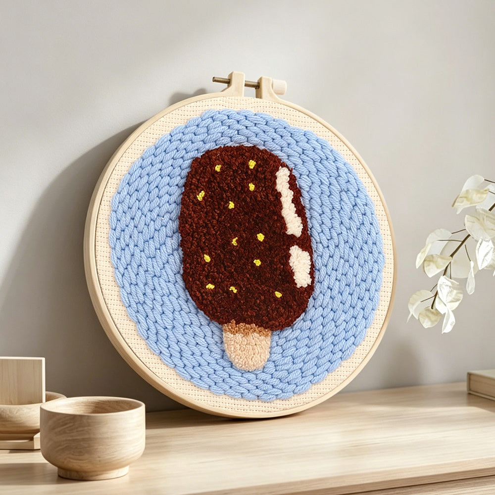 Chocolate ice cream punch needle artwork displayed on a table