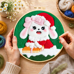 Creating the christmas bunny with gift wool painting by hand with a felting needle