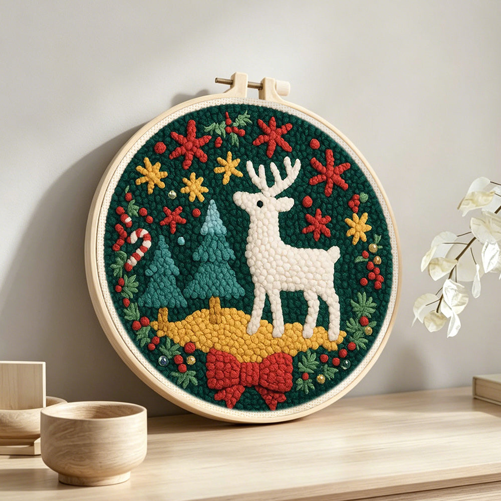 Christmas decorations and reindeer punch needle artwork displayed on a table