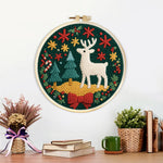 Finished christmas decorations and reindeer artwork displayed on a wall