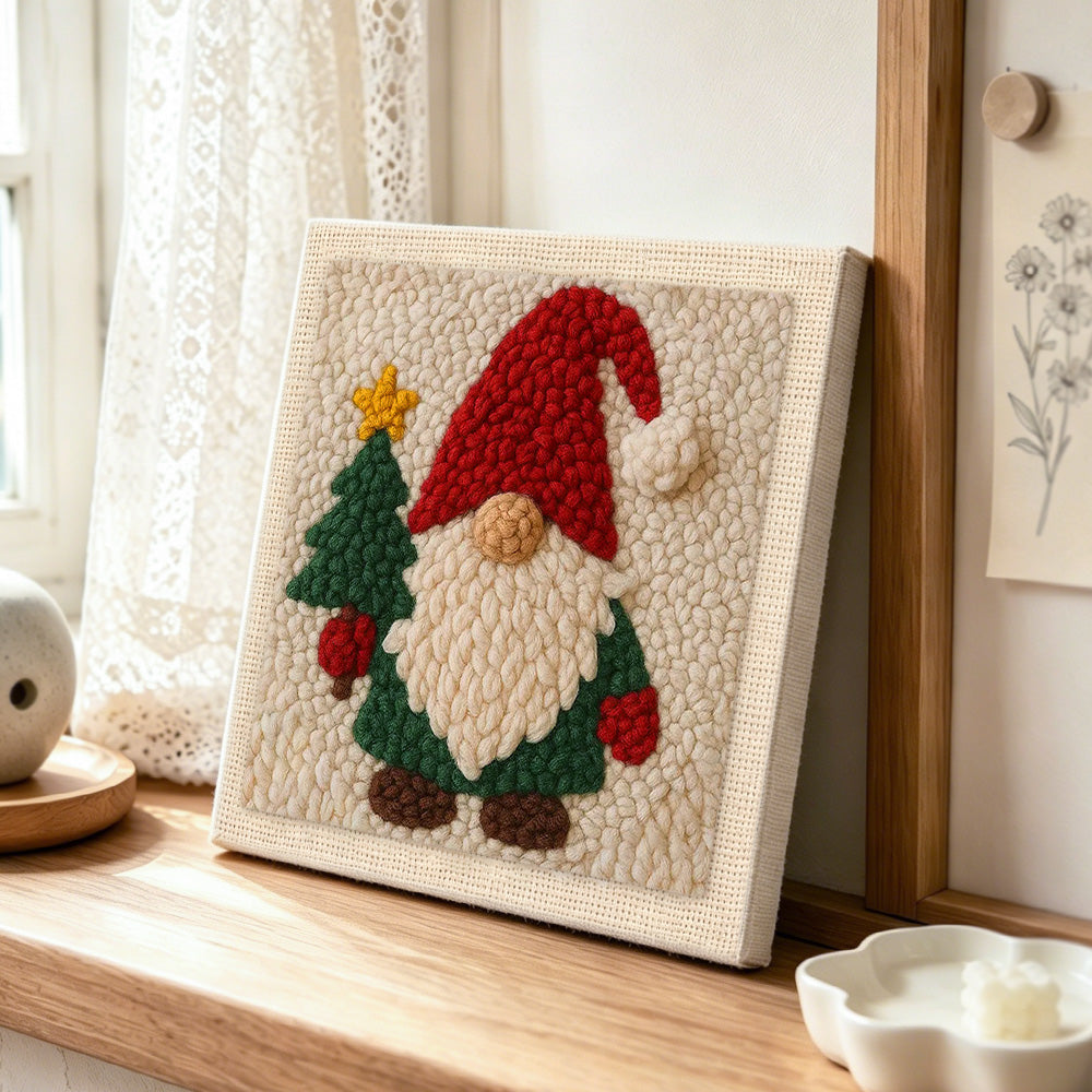 Christmas gnome and tree punch needle artwork displayed on a table