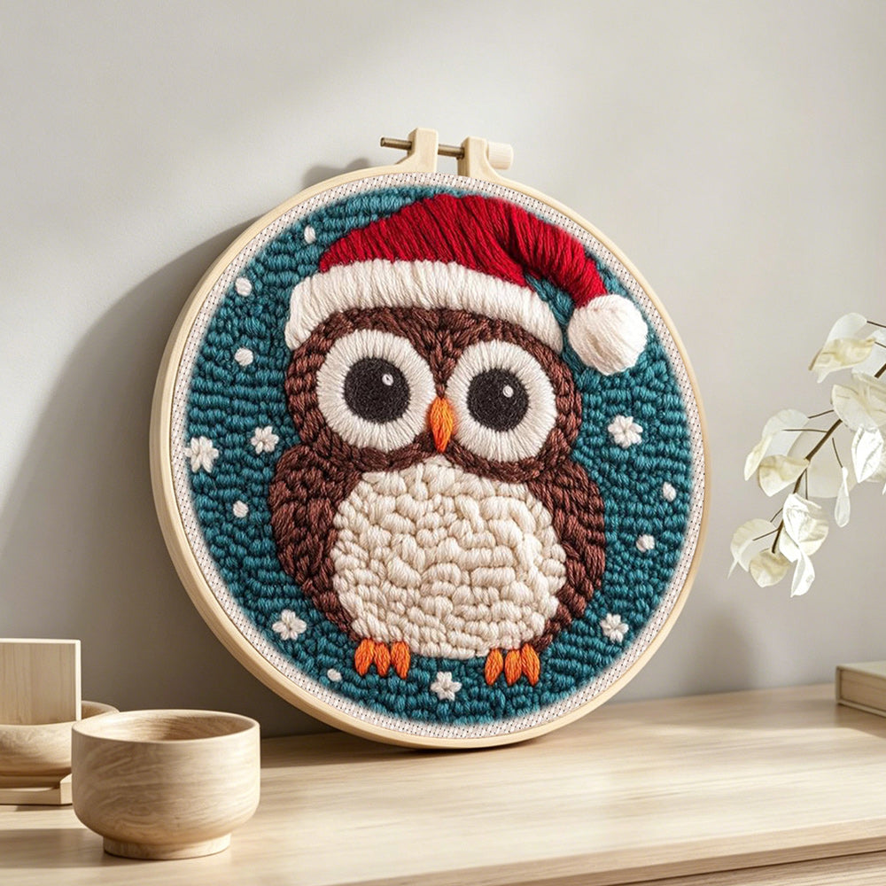 Christmas owl punch needle artwork displayed on a table