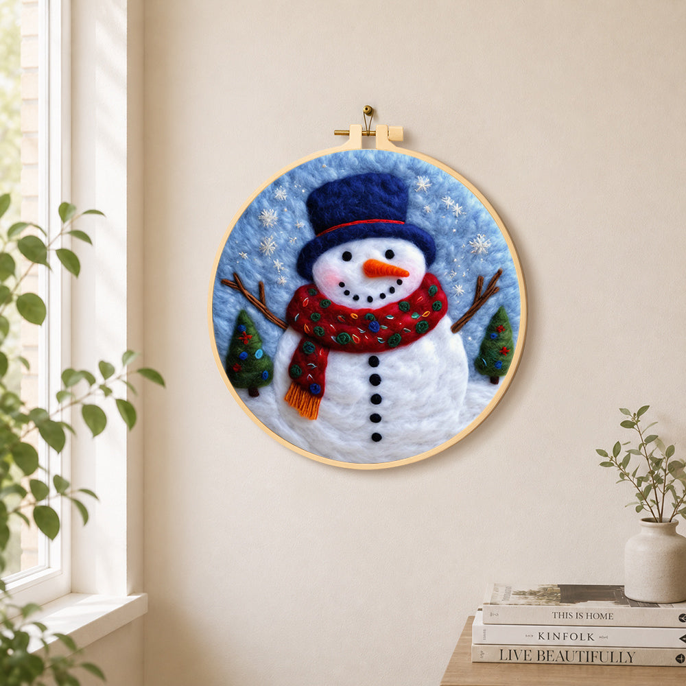 Christmas snowman with blue top needle felt wall art displayed in a bright home interior