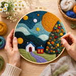 Creating the christmas tree and winter village wool painting by hand with a felting needle