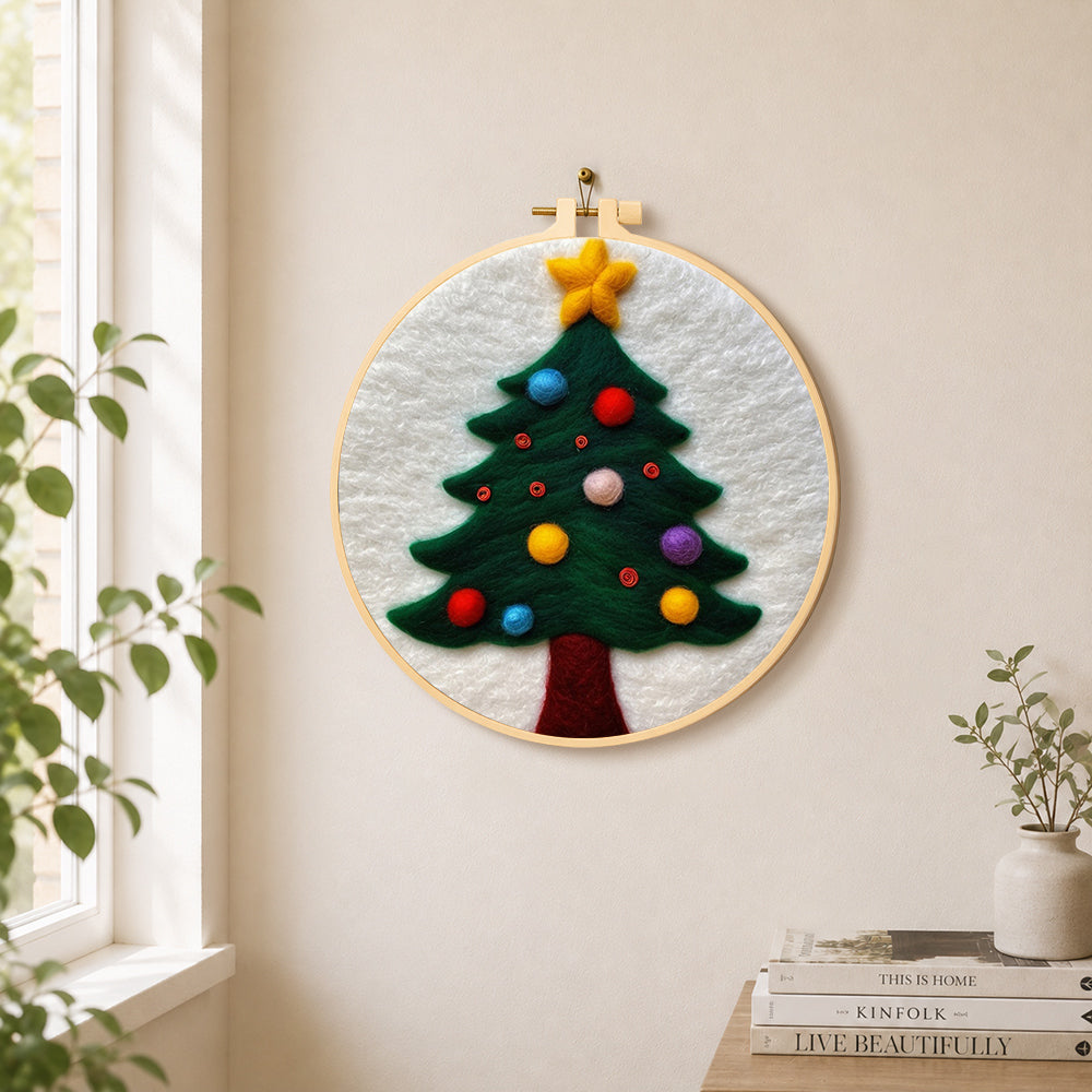 Christmas tree with colourful baubles needle felt wall art displayed in a bright home interior