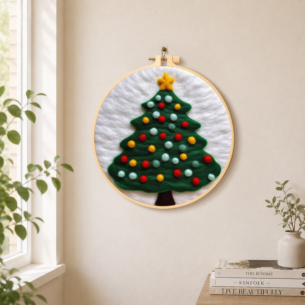 Christmas tree with lots of bright baubles needle felt wall art displayed in a bright home interior