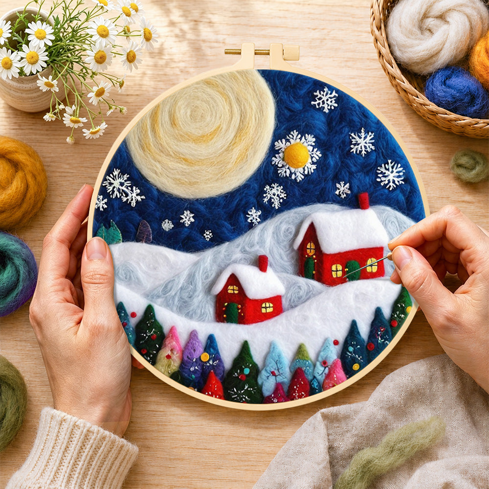 Creating the christmas village with big moon wool painting by hand with a felting needle