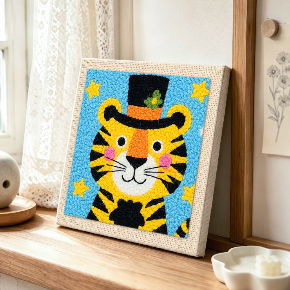 Circus tiger with stars and hat punch needle artwork displayed on a table