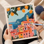 Creating handmade citrus coastal town punch needle artwork
