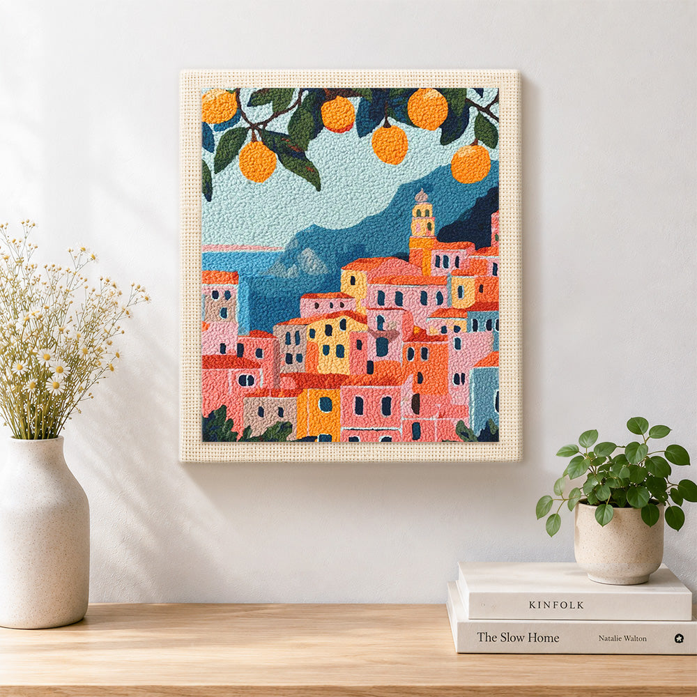 Finished citrus coastal town artwork displayed on a wall