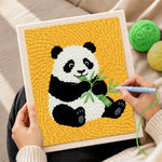 Creating handmade classic panda eating bamboo punch needle artwork