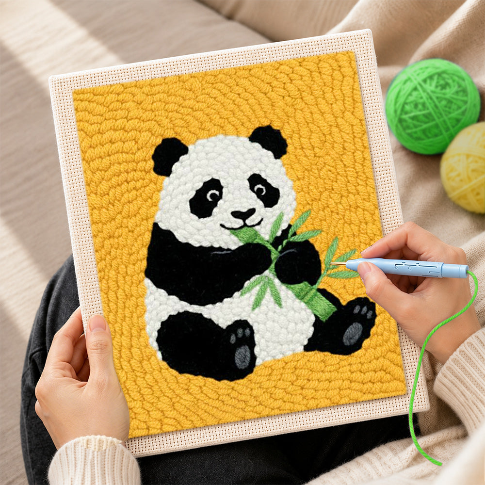 Creating handmade classic panda eating bamboo punch needle artwork