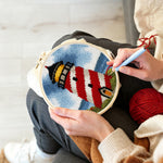 Creating handmade classic red and white striped lighthouse punch needle artwork
