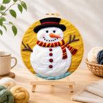 Finished classic red and yellow striped scarf snowman needle felting displayed on a wooden easel
