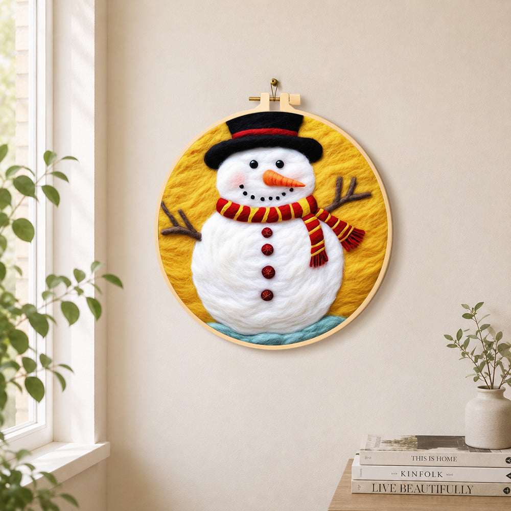 Classic red and yellow striped scarf snowman needle felt wall art displayed in a bright home interior