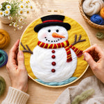 Creating the classic red and yellow striped scarf snowman wool painting by hand with a felting needle