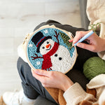 Creating handmade classic snowman with red scarf punch needle artwork