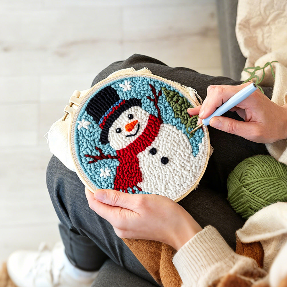 Creating handmade classic snowman with red scarf punch needle artwork