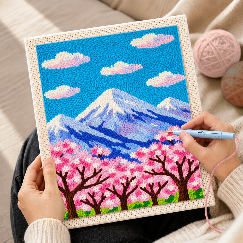 Creating handmade cloudy sakura mountain punch needle artwork
