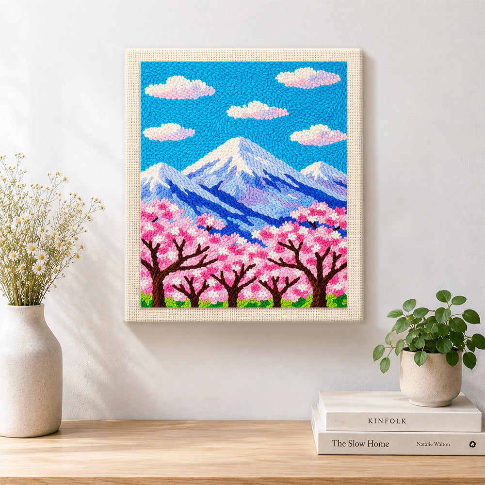Finished cloudy sakura mountain artwork displayed on a wall
