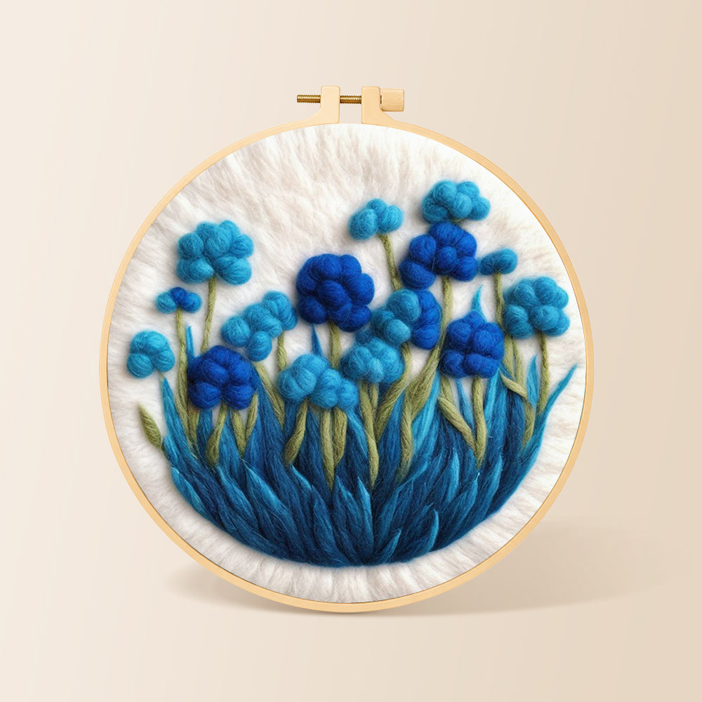 Cluster of blue flowers needle felting kit for beginners with a round wooden frame