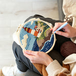 Creating handmade coastal lighthouse and crashing waves punch needle artwork