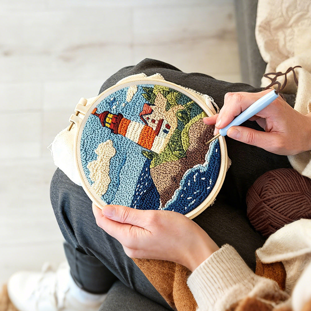 Creating handmade coastal lighthouse and crashing waves punch needle artwork