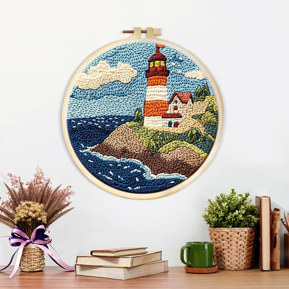 Finished coastal lighthouse and crashing waves artwork displayed on a wall