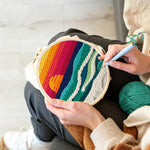 Creating handmade coastal sunset ocean punch needle artwork