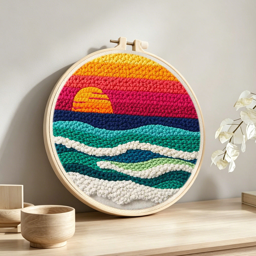 Coastal sunset ocean punch needle artwork displayed on a table