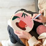 Creating handmade coffee cup and leaf punch needle artwork