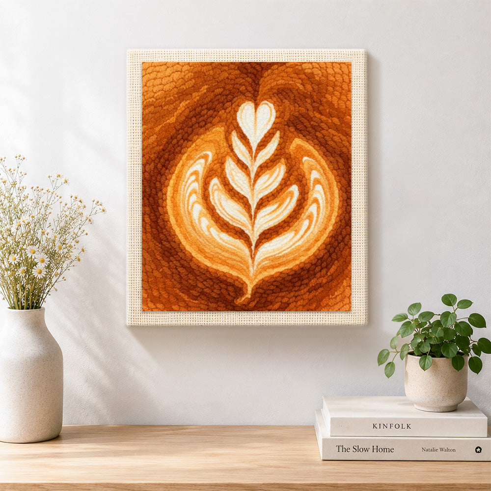 Finished coffee with leaf pattern latte art artwork displayed on a wall