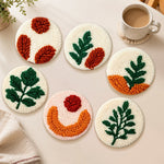 Colour-block botanical punch needle coasters used for home decoration