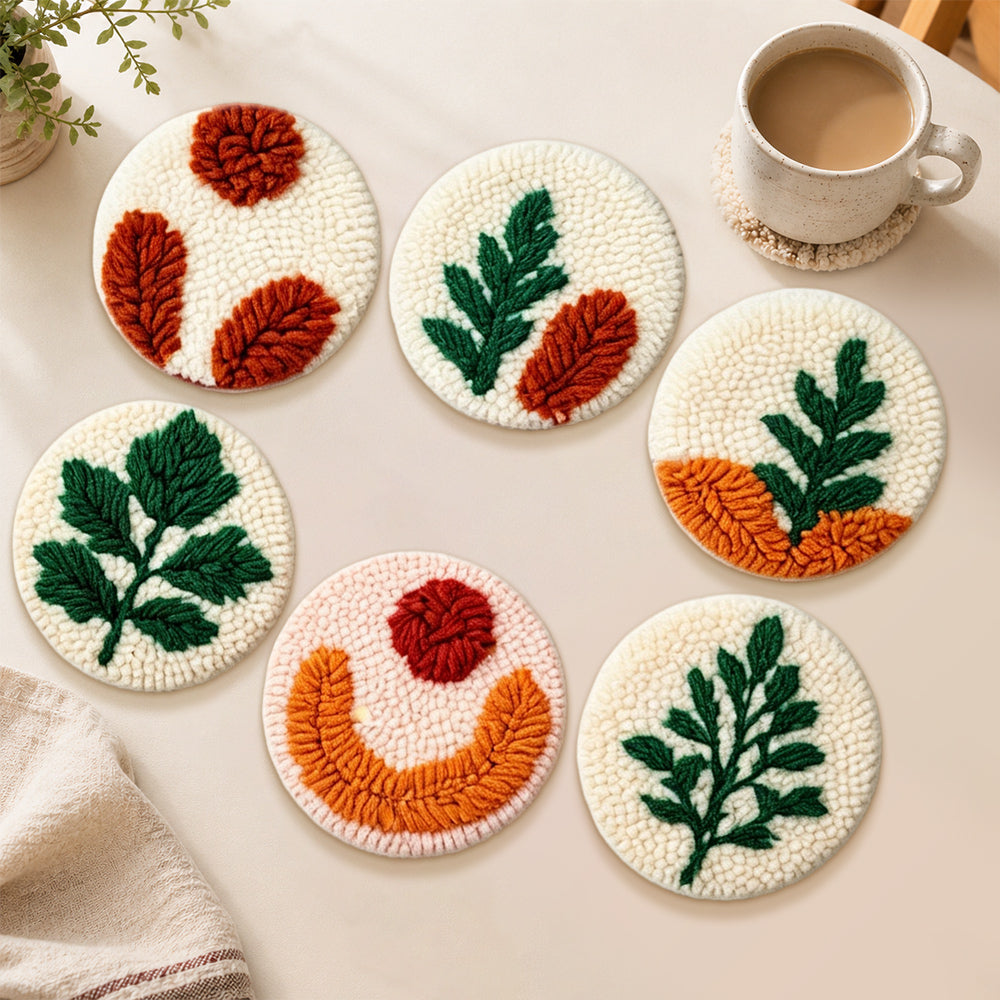 Colour-block botanical punch needle coasters used for home decoration