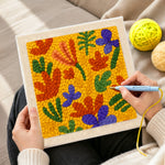 Creating handmade colourful abstract petals punch needle artwork