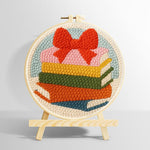 Colourful book stack with bow punch needle kit for beginners