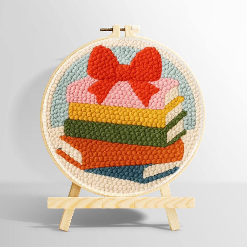 Colourful book stack with bow punch needle kit for beginners