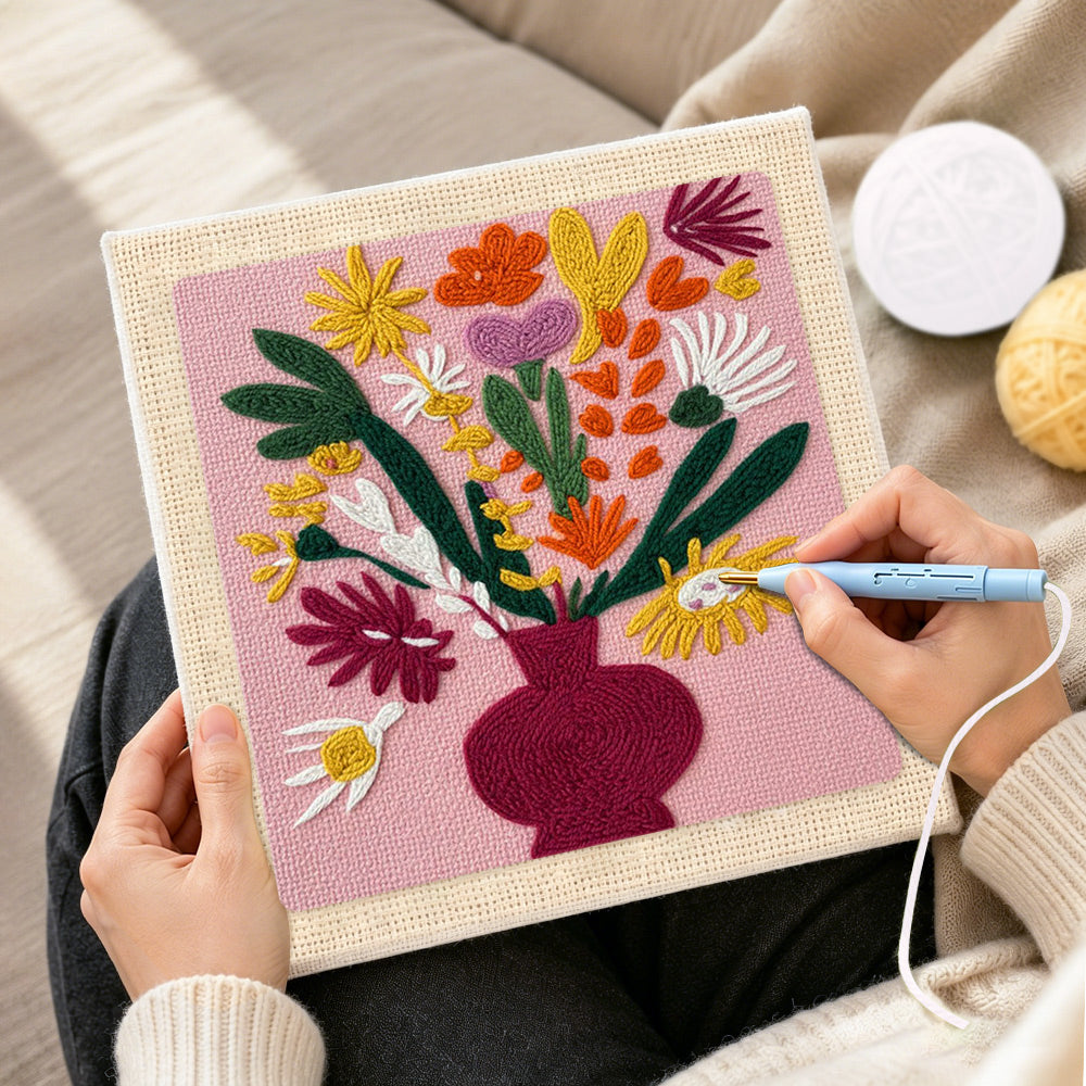 Creating handmade colourful bouquet in burgundy vase punch needle artwork