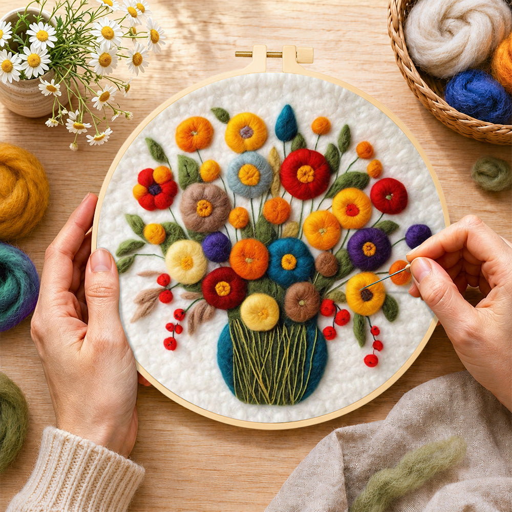 Creating the colourful bouquet with berries wool painting by hand with a felting needle