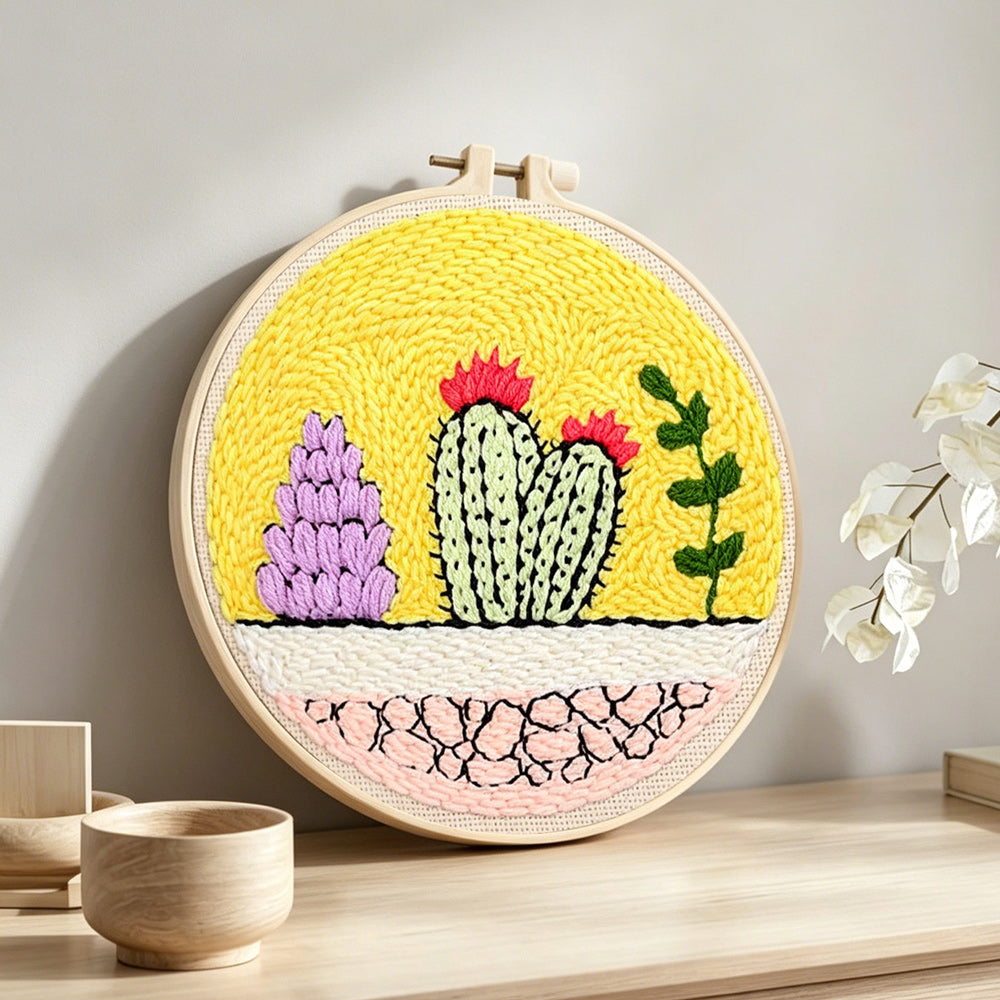 Colourful cacti garden punch needle artwork displayed on a table