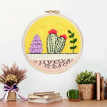 Finished colourful cacti garden artwork displayed on a wall