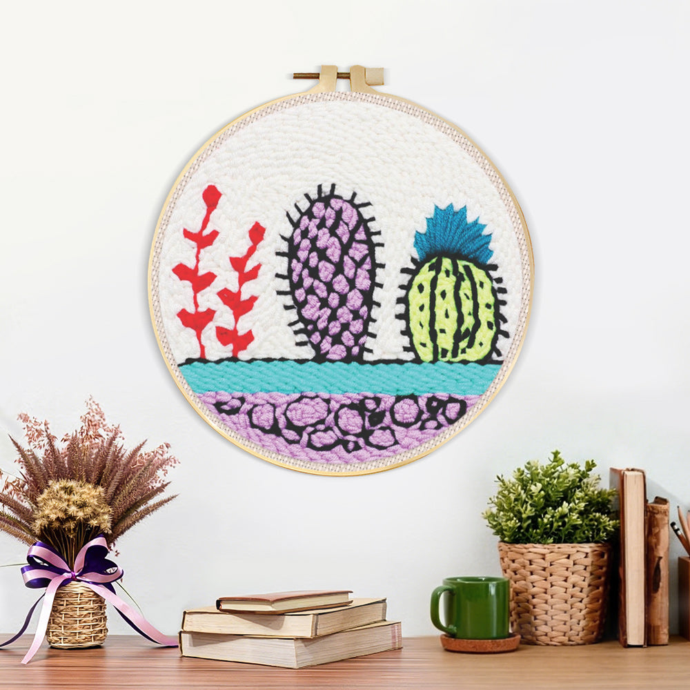 Finished colourful cactus trio artwork displayed on a wall