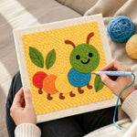 Creating handmade colourful caterpillar punch needle artwork