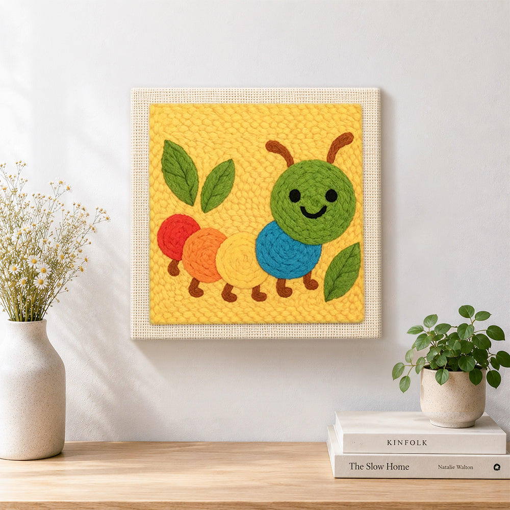 Finished colourful caterpillar artwork displayed on a wall