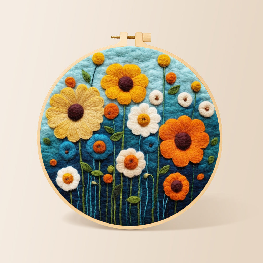 Colourful daisies on dark blue needle felting kit for beginners with a round wooden frame