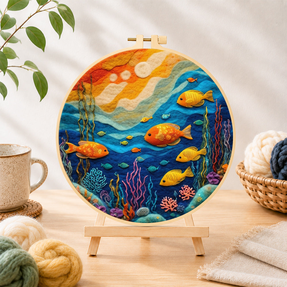 Finished colourful deep-sea fish needle felting displayed on a wooden easel