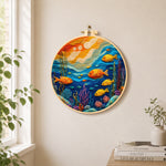 Colourful deep-sea fish needle felt wall art displayed in a bright home interior