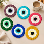 Colourful evil eye punch needle coasters used for home decoration