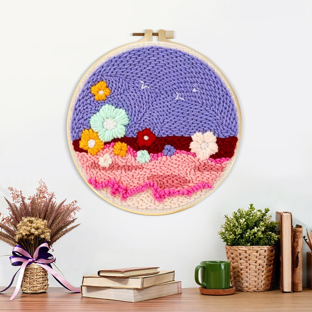 Finished colourful flowers on purple sky artwork displayed on a wall