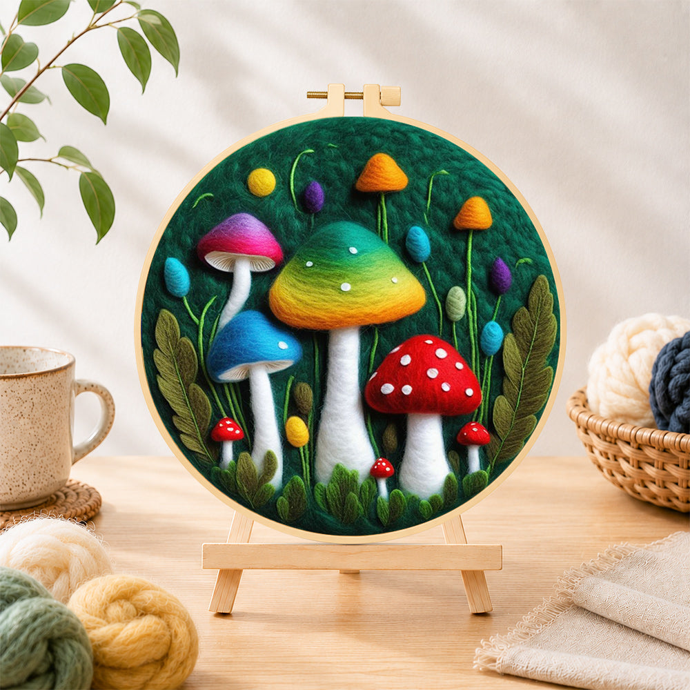 Finished colourful gradient mushrooms needle felting displayed on a wooden easel